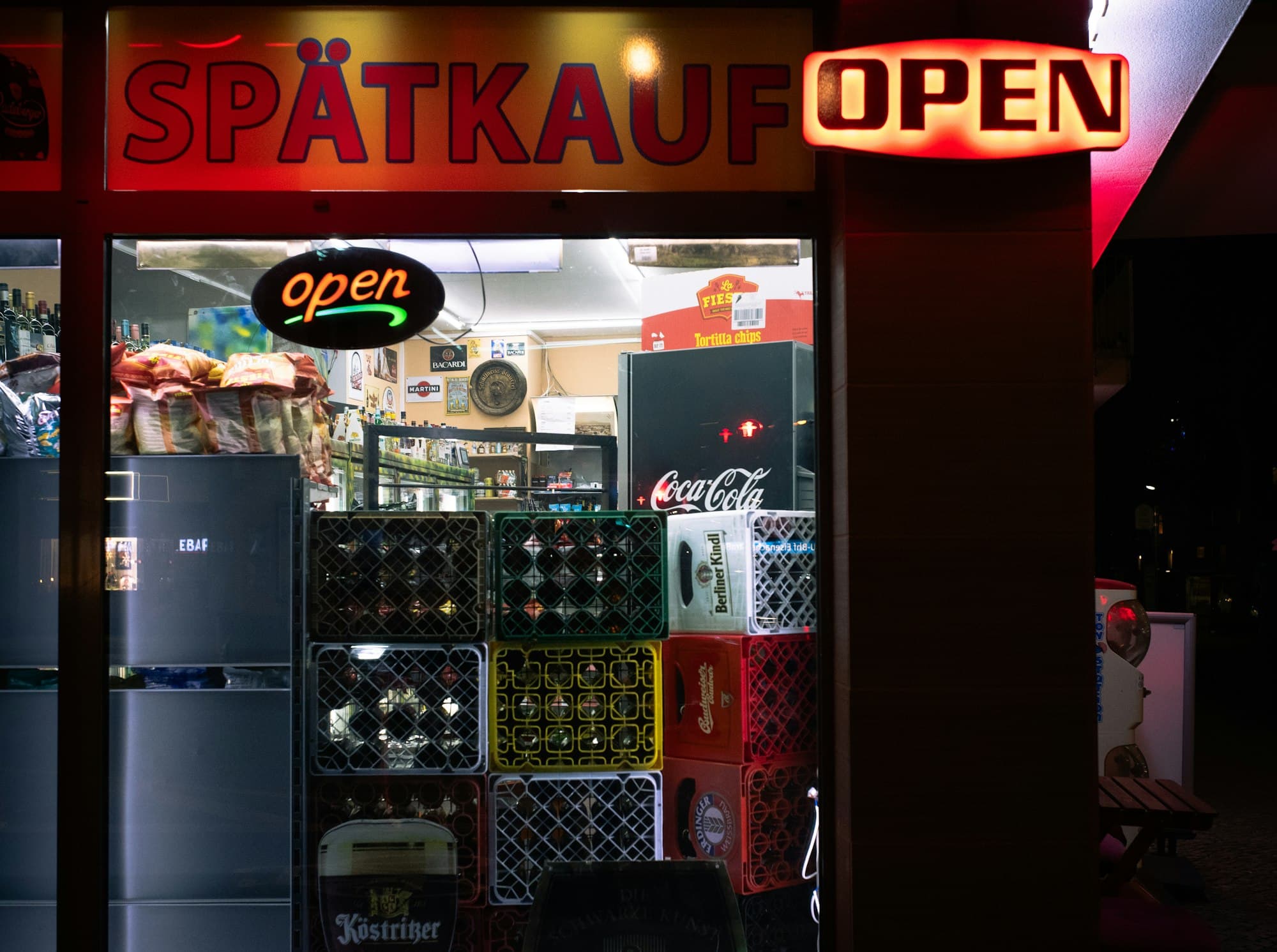 Crates of bottles outside a late-night corner shop in Berlin